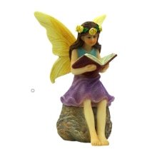 Fairy reading a book